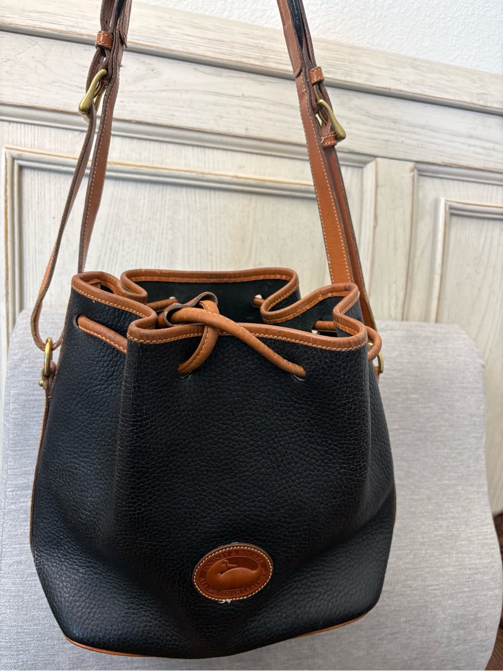 Dooney & Bourke All Weather Leather AWL Navy/Tan Drawstring
Bucket Bag EUC